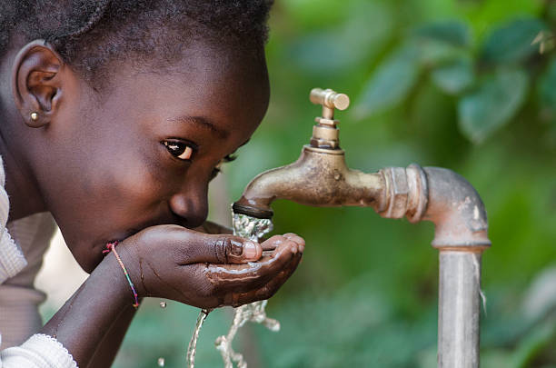 Children playing with clean water at Kalambo Primary School